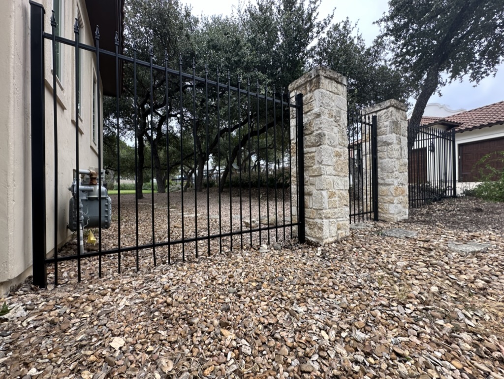 rusty wrought iron fence